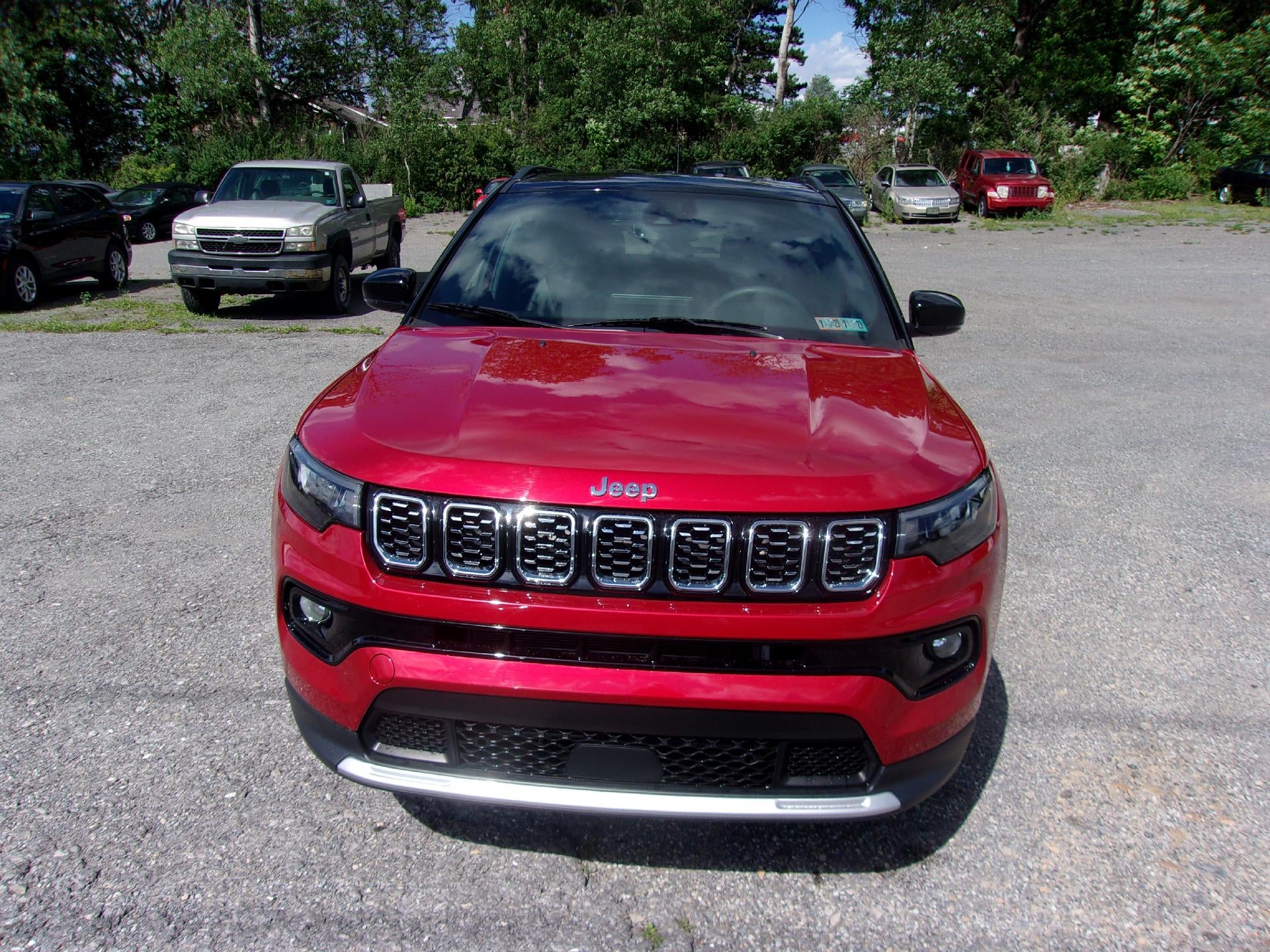 2024 Jeep Compass Limited 4x4 in Red Hot Pearlcoat — front three-quarter view